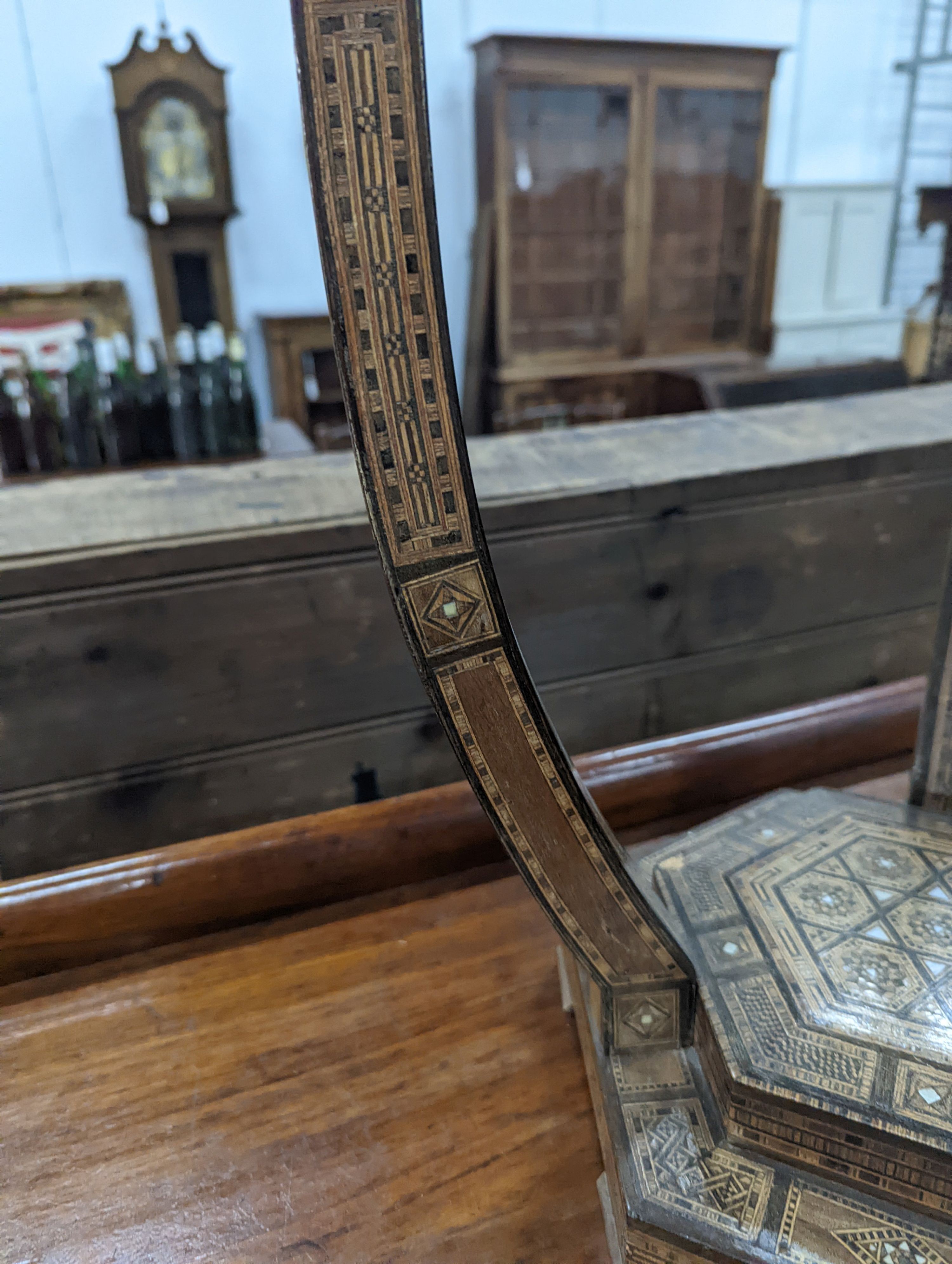 A Moorish bone and parquetry inlaid two tier occasional table, diameter 41cm, height 52cm